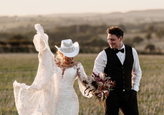 • “Bride and groom standing hand in hand outside Runa Farm’s rustic stone barn – a perfect Durham wedding venue.” • “Candid wedding moment at Runa Farm – newlyweds laughing together under twinkling lights.” • “Elegant boho wedding dress at Runa Farm – bride posing against the venue’s countryside backdrop.” • “Runa Farm wedding setup – long wooden tables, rustic décor, and soft candlelight for a romantic reception.” • “Sunset wedding portraits at Runa Farm – golden hour glow over the rolling Durham countryside.” • “Stylish groom at Runa Farm – a modern take on rustic wedding fashion.” • “The moment they said ‘I do’ – bride and groom exchanging vows in Runa Farm’s barn ceremony space.” • “Runa Farm wedding celebrations – guests raising a toast in a beautifully styled barn reception.” • “Newlyweds sharing their first dance at Runa Farm – a magical moment under fairy lights.” • “Fun wedding party portraits at Runa Farm – bridesmaids and groomsmen celebrating in the countryside.” • “Beautiful wedding bouquet at Runa Farm – dried florals, soft pastels, and rustic charm.” • “Relaxed wedding morning at Runa Farm – bride enjoying a quiet moment before the ceremony.” • “Outdoor wedding drinks reception at Runa Farm – couples and guests enjoying the sunshine and countryside views.” • “Romantic countryside wedding at Runa Farm – couple walking through lush fields at sunset.” • “Runa Farm wedding cake – elegant design with dried flowers and a rustic-luxe finish.” • “Bridal party getting ready at Runa Farm – laughter, champagne, and the perfect pre-wedding moments.” • “Emotional groom watching his bride walk down the aisle at Runa Farm’s intimate barn setting.” • “Boho-inspired wedding styling at Runa Farm – warm tones, pampas grass, and rustic wooden details.” • “Confetti moment at Runa Farm – bride and groom celebrating with family and friends in a joyful shower of petals.” • “Romantic wedding reception at Runa Farm – candlelit tables, rustic beams, and a warm, cozy atmosphere.” • “Bride and groom sharing a private moment outside Runa Farm’s stunning stone architecture.” • “Wedding guests enjoying a relaxed al fresco drinks reception at Runa Farm’s outdoor courtyard.” • “Rustic barn wedding inspiration at Runa Farm – dreamy styling with fairy lights and natural textures.” • “Newlyweds embracing outside Runa Farm’s picturesque countryside backdrop – the perfect Durham wedding setting.” • “Groom waiting at the altar at Runa Farm – the perfect rustic wedding venue for an intimate ceremony.” • “Bridal portraits at Runa Farm – timeless elegance meets countryside charm.” • “Golden hour wedding photography at Runa Farm – romantic sunset portraits of the newlyweds.” • “Sparkler exit at Runa Farm – magical wedding send-off under a starry North East sky.” • “Bride and groom sharing a relaxed moment by Runa Farm’s rustic wooden gates.” • “Romantic first look at Runa Farm – groom’s emotional reaction to seeing his bride.” • “Natural wedding photography at Runa Farm – capturing authentic moments of love and joy.” • “Bridal details at Runa Farm – lace wedding gown, delicate florals, and rustic-chic styling.” • “Outdoor wedding portraits at Runa Farm – capturing the couple in a breathtaking countryside setting.” • “Guests celebrating at Runa Farm wedding reception – joyful candid moments on the dance floor.” • “Modern rustic wedding décor at Runa Farm – beautifully styled tables with earthy tones and fresh flowers.” • “Newlyweds enjoying a quiet moment at Runa Farm’s scenic outdoor spaces.” • “Groom buttoning up his suit before the ceremony at Runa Farm – stylish and relaxed wedding morning.” • “Wedding party group shots at Runa Farm – fun, natural, and full of personality.” • “Intimate wedding dinner setup at Runa Farm – romantic lighting and beautifully arranged tables.”