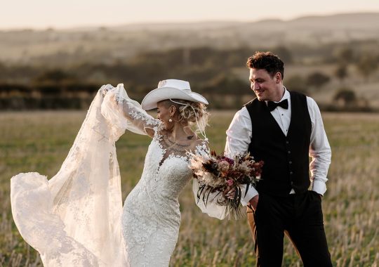 • “Bride and groom standing hand in hand outside Runa Farm’s rustic stone barn – a perfect Durham wedding venue.” • “Candid wedding moment at Runa Farm – newlyweds laughing together under twinkling lights.” • “Elegant boho wedding dress at Runa Farm – bride posing against the venue’s countryside backdrop.” • “Runa Farm wedding setup – long wooden tables, rustic décor, and soft candlelight for a romantic reception.” • “Sunset wedding portraits at Runa Farm – golden hour glow over the rolling Durham countryside.” • “Stylish groom at Runa Farm – a modern take on rustic wedding fashion.” • “The moment they said ‘I do’ – bride and groom exchanging vows in Runa Farm’s barn ceremony space.” • “Runa Farm wedding celebrations – guests raising a toast in a beautifully styled barn reception.” • “Newlyweds sharing their first dance at Runa Farm – a magical moment under fairy lights.” • “Fun wedding party portraits at Runa Farm – bridesmaids and groomsmen celebrating in the countryside.” • “Beautiful wedding bouquet at Runa Farm – dried florals, soft pastels, and rustic charm.” • “Relaxed wedding morning at Runa Farm – bride enjoying a quiet moment before the ceremony.” • “Outdoor wedding drinks reception at Runa Farm – couples and guests enjoying the sunshine and countryside views.” • “Romantic countryside wedding at Runa Farm – couple walking through lush fields at sunset.” • “Runa Farm wedding cake – elegant design with dried flowers and a rustic-luxe finish.” • “Bridal party getting ready at Runa Farm – laughter, champagne, and the perfect pre-wedding moments.” • “Emotional groom watching his bride walk down the aisle at Runa Farm’s intimate barn setting.” • “Boho-inspired wedding styling at Runa Farm – warm tones, pampas grass, and rustic wooden details.” • “Confetti moment at Runa Farm – bride and groom celebrating with family and friends in a joyful shower of petals.” • “Romantic wedding reception at Runa Farm – candlelit tables, rustic beams, and a warm, cozy atmosphere.” • “Bride and groom sharing a private moment outside Runa Farm’s stunning stone architecture.” • “Wedding guests enjoying a relaxed al fresco drinks reception at Runa Farm’s outdoor courtyard.” • “Rustic barn wedding inspiration at Runa Farm – dreamy styling with fairy lights and natural textures.” • “Newlyweds embracing outside Runa Farm’s picturesque countryside backdrop – the perfect Durham wedding setting.” • “Groom waiting at the altar at Runa Farm – the perfect rustic wedding venue for an intimate ceremony.” • “Bridal portraits at Runa Farm – timeless elegance meets countryside charm.” • “Golden hour wedding photography at Runa Farm – romantic sunset portraits of the newlyweds.” • “Sparkler exit at Runa Farm – magical wedding send-off under a starry North East sky.” • “Bride and groom sharing a relaxed moment by Runa Farm’s rustic wooden gates.” • “Romantic first look at Runa Farm – groom’s emotional reaction to seeing his bride.” • “Natural wedding photography at Runa Farm – capturing authentic moments of love and joy.” • “Bridal details at Runa Farm – lace wedding gown, delicate florals, and rustic-chic styling.” • “Outdoor wedding portraits at Runa Farm – capturing the couple in a breathtaking countryside setting.” • “Guests celebrating at Runa Farm wedding reception – joyful candid moments on the dance floor.” • “Modern rustic wedding décor at Runa Farm – beautifully styled tables with earthy tones and fresh flowers.” • “Newlyweds enjoying a quiet moment at Runa Farm’s scenic outdoor spaces.” • “Groom buttoning up his suit before the ceremony at Runa Farm – stylish and relaxed wedding morning.” • “Wedding party group shots at Runa Farm – fun, natural, and full of personality.” • “Intimate wedding dinner setup at Runa Farm – romantic lighting and beautifully arranged tables.”