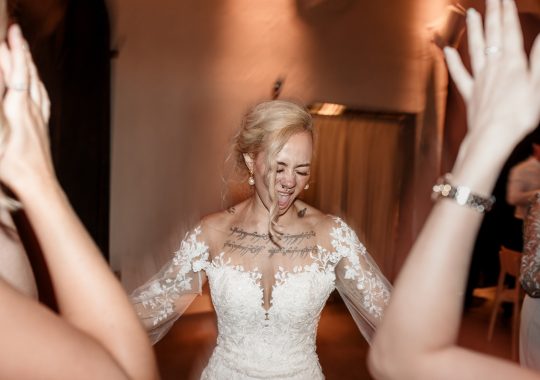 • “Bride and groom standing hand in hand outside Runa Farm’s rustic stone barn – a perfect Durham wedding venue.” • “Candid wedding moment at Runa Farm – newlyweds laughing together under twinkling lights.” • “Elegant boho wedding dress at Runa Farm – bride posing against the venue’s countryside backdrop.” • “Runa Farm wedding setup – long wooden tables, rustic décor, and soft candlelight for a romantic reception.” • “Sunset wedding portraits at Runa Farm – golden hour glow over the rolling Durham countryside.” • “Stylish groom at Runa Farm – a modern take on rustic wedding fashion.” • “The moment they said ‘I do’ – bride and groom exchanging vows in Runa Farm’s barn ceremony space.” • “Runa Farm wedding celebrations – guests raising a toast in a beautifully styled barn reception.” • “Newlyweds sharing their first dance at Runa Farm – a magical moment under fairy lights.” • “Fun wedding party portraits at Runa Farm – bridesmaids and groomsmen celebrating in the countryside.” • “Beautiful wedding bouquet at Runa Farm – dried florals, soft pastels, and rustic charm.” • “Relaxed wedding morning at Runa Farm – bride enjoying a quiet moment before the ceremony.” • “Outdoor wedding drinks reception at Runa Farm – couples and guests enjoying the sunshine and countryside views.” • “Romantic countryside wedding at Runa Farm – couple walking through lush fields at sunset.” • “Runa Farm wedding cake – elegant design with dried flowers and a rustic-luxe finish.” • “Bridal party getting ready at Runa Farm – laughter, champagne, and the perfect pre-wedding moments.” • “Emotional groom watching his bride walk down the aisle at Runa Farm’s intimate barn setting.” • “Boho-inspired wedding styling at Runa Farm – warm tones, pampas grass, and rustic wooden details.” • “Confetti moment at Runa Farm – bride and groom celebrating with family and friends in a joyful shower of petals.” • “Romantic wedding reception at Runa Farm – candlelit tables, rustic beams, and a warm, cozy atmosphere.” • “Bride and groom sharing a private moment outside Runa Farm’s stunning stone architecture.” • “Wedding guests enjoying a relaxed al fresco drinks reception at Runa Farm’s outdoor courtyard.” • “Rustic barn wedding inspiration at Runa Farm – dreamy styling with fairy lights and natural textures.” • “Newlyweds embracing outside Runa Farm’s picturesque countryside backdrop – the perfect Durham wedding setting.” • “Groom waiting at the altar at Runa Farm – the perfect rustic wedding venue for an intimate ceremony.” • “Bridal portraits at Runa Farm – timeless elegance meets countryside charm.” • “Golden hour wedding photography at Runa Farm – romantic sunset portraits of the newlyweds.” • “Sparkler exit at Runa Farm – magical wedding send-off under a starry North East sky.” • “Bride and groom sharing a relaxed moment by Runa Farm’s rustic wooden gates.” • “Romantic first look at Runa Farm – groom’s emotional reaction to seeing his bride.” • “Natural wedding photography at Runa Farm – capturing authentic moments of love and joy.” • “Bridal details at Runa Farm – lace wedding gown, delicate florals, and rustic-chic styling.” • “Outdoor wedding portraits at Runa Farm – capturing the couple in a breathtaking countryside setting.” • “Guests celebrating at Runa Farm wedding reception – joyful candid moments on the dance floor.” • “Modern rustic wedding décor at Runa Farm – beautifully styled tables with earthy tones and fresh flowers.” • “Newlyweds enjoying a quiet moment at Runa Farm’s scenic outdoor spaces.” • “Groom buttoning up his suit before the ceremony at Runa Farm – stylish and relaxed wedding morning.” • “Wedding party group shots at Runa Farm – fun, natural, and full of personality.” • “Intimate wedding dinner setup at Runa Farm – romantic lighting and beautifully arranged tables.”