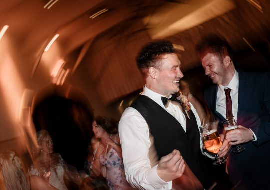 • “Bride and groom standing hand in hand outside Runa Farm’s rustic stone barn – a perfect Durham wedding venue.” • “Candid wedding moment at Runa Farm – newlyweds laughing together under twinkling lights.” • “Elegant boho wedding dress at Runa Farm – bride posing against the venue’s countryside backdrop.” • “Runa Farm wedding setup – long wooden tables, rustic décor, and soft candlelight for a romantic reception.” • “Sunset wedding portraits at Runa Farm – golden hour glow over the rolling Durham countryside.” • “Stylish groom at Runa Farm – a modern take on rustic wedding fashion.” • “The moment they said ‘I do’ – bride and groom exchanging vows in Runa Farm’s barn ceremony space.” • “Runa Farm wedding celebrations – guests raising a toast in a beautifully styled barn reception.” • “Newlyweds sharing their first dance at Runa Farm – a magical moment under fairy lights.” • “Fun wedding party portraits at Runa Farm – bridesmaids and groomsmen celebrating in the countryside.” • “Beautiful wedding bouquet at Runa Farm – dried florals, soft pastels, and rustic charm.” • “Relaxed wedding morning at Runa Farm – bride enjoying a quiet moment before the ceremony.” • “Outdoor wedding drinks reception at Runa Farm – couples and guests enjoying the sunshine and countryside views.” • “Romantic countryside wedding at Runa Farm – couple walking through lush fields at sunset.” • “Runa Farm wedding cake – elegant design with dried flowers and a rustic-luxe finish.” • “Bridal party getting ready at Runa Farm – laughter, champagne, and the perfect pre-wedding moments.” • “Emotional groom watching his bride walk down the aisle at Runa Farm’s intimate barn setting.” • “Boho-inspired wedding styling at Runa Farm – warm tones, pampas grass, and rustic wooden details.” • “Confetti moment at Runa Farm – bride and groom celebrating with family and friends in a joyful shower of petals.” • “Romantic wedding reception at Runa Farm – candlelit tables, rustic beams, and a warm, cozy atmosphere.” • “Bride and groom sharing a private moment outside Runa Farm’s stunning stone architecture.” • “Wedding guests enjoying a relaxed al fresco drinks reception at Runa Farm’s outdoor courtyard.” • “Rustic barn wedding inspiration at Runa Farm – dreamy styling with fairy lights and natural textures.” • “Newlyweds embracing outside Runa Farm’s picturesque countryside backdrop – the perfect Durham wedding setting.” • “Groom waiting at the altar at Runa Farm – the perfect rustic wedding venue for an intimate ceremony.” • “Bridal portraits at Runa Farm – timeless elegance meets countryside charm.” • “Golden hour wedding photography at Runa Farm – romantic sunset portraits of the newlyweds.” • “Sparkler exit at Runa Farm – magical wedding send-off under a starry North East sky.” • “Bride and groom sharing a relaxed moment by Runa Farm’s rustic wooden gates.” • “Romantic first look at Runa Farm – groom’s emotional reaction to seeing his bride.” • “Natural wedding photography at Runa Farm – capturing authentic moments of love and joy.” • “Bridal details at Runa Farm – lace wedding gown, delicate florals, and rustic-chic styling.” • “Outdoor wedding portraits at Runa Farm – capturing the couple in a breathtaking countryside setting.” • “Guests celebrating at Runa Farm wedding reception – joyful candid moments on the dance floor.” • “Modern rustic wedding décor at Runa Farm – beautifully styled tables with earthy tones and fresh flowers.” • “Newlyweds enjoying a quiet moment at Runa Farm’s scenic outdoor spaces.” • “Groom buttoning up his suit before the ceremony at Runa Farm – stylish and relaxed wedding morning.” • “Wedding party group shots at Runa Farm – fun, natural, and full of personality.” • “Intimate wedding dinner setup at Runa Farm – romantic lighting and beautifully arranged tables.”