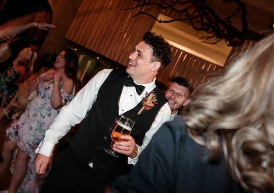 • “Bride and groom standing hand in hand outside Runa Farm’s rustic stone barn – a perfect Durham wedding venue.” • “Candid wedding moment at Runa Farm – newlyweds laughing together under twinkling lights.” • “Elegant boho wedding dress at Runa Farm – bride posing against the venue’s countryside backdrop.” • “Runa Farm wedding setup – long wooden tables, rustic décor, and soft candlelight for a romantic reception.” • “Sunset wedding portraits at Runa Farm – golden hour glow over the rolling Durham countryside.” • “Stylish groom at Runa Farm – a modern take on rustic wedding fashion.” • “The moment they said ‘I do’ – bride and groom exchanging vows in Runa Farm’s barn ceremony space.” • “Runa Farm wedding celebrations – guests raising a toast in a beautifully styled barn reception.” • “Newlyweds sharing their first dance at Runa Farm – a magical moment under fairy lights.” • “Fun wedding party portraits at Runa Farm – bridesmaids and groomsmen celebrating in the countryside.” • “Beautiful wedding bouquet at Runa Farm – dried florals, soft pastels, and rustic charm.” • “Relaxed wedding morning at Runa Farm – bride enjoying a quiet moment before the ceremony.” • “Outdoor wedding drinks reception at Runa Farm – couples and guests enjoying the sunshine and countryside views.” • “Romantic countryside wedding at Runa Farm – couple walking through lush fields at sunset.” • “Runa Farm wedding cake – elegant design with dried flowers and a rustic-luxe finish.” • “Bridal party getting ready at Runa Farm – laughter, champagne, and the perfect pre-wedding moments.” • “Emotional groom watching his bride walk down the aisle at Runa Farm’s intimate barn setting.” • “Boho-inspired wedding styling at Runa Farm – warm tones, pampas grass, and rustic wooden details.” • “Confetti moment at Runa Farm – bride and groom celebrating with family and friends in a joyful shower of petals.” • “Romantic wedding reception at Runa Farm – candlelit tables, rustic beams, and a warm, cozy atmosphere.” • “Bride and groom sharing a private moment outside Runa Farm’s stunning stone architecture.” • “Wedding guests enjoying a relaxed al fresco drinks reception at Runa Farm’s outdoor courtyard.” • “Rustic barn wedding inspiration at Runa Farm – dreamy styling with fairy lights and natural textures.” • “Newlyweds embracing outside Runa Farm’s picturesque countryside backdrop – the perfect Durham wedding setting.” • “Groom waiting at the altar at Runa Farm – the perfect rustic wedding venue for an intimate ceremony.” • “Bridal portraits at Runa Farm – timeless elegance meets countryside charm.” • “Golden hour wedding photography at Runa Farm – romantic sunset portraits of the newlyweds.” • “Sparkler exit at Runa Farm – magical wedding send-off under a starry North East sky.” • “Bride and groom sharing a relaxed moment by Runa Farm’s rustic wooden gates.” • “Romantic first look at Runa Farm – groom’s emotional reaction to seeing his bride.” • “Natural wedding photography at Runa Farm – capturing authentic moments of love and joy.” • “Bridal details at Runa Farm – lace wedding gown, delicate florals, and rustic-chic styling.” • “Outdoor wedding portraits at Runa Farm – capturing the couple in a breathtaking countryside setting.” • “Guests celebrating at Runa Farm wedding reception – joyful candid moments on the dance floor.” • “Modern rustic wedding décor at Runa Farm – beautifully styled tables with earthy tones and fresh flowers.” • “Newlyweds enjoying a quiet moment at Runa Farm’s scenic outdoor spaces.” • “Groom buttoning up his suit before the ceremony at Runa Farm – stylish and relaxed wedding morning.” • “Wedding party group shots at Runa Farm – fun, natural, and full of personality.” • “Intimate wedding dinner setup at Runa Farm – romantic lighting and beautifully arranged tables.”