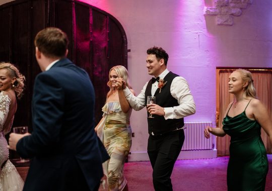 • “Bride and groom standing hand in hand outside Runa Farm’s rustic stone barn – a perfect Durham wedding venue.” • “Candid wedding moment at Runa Farm – newlyweds laughing together under twinkling lights.” • “Elegant boho wedding dress at Runa Farm – bride posing against the venue’s countryside backdrop.” • “Runa Farm wedding setup – long wooden tables, rustic décor, and soft candlelight for a romantic reception.” • “Sunset wedding portraits at Runa Farm – golden hour glow over the rolling Durham countryside.” • “Stylish groom at Runa Farm – a modern take on rustic wedding fashion.” • “The moment they said ‘I do’ – bride and groom exchanging vows in Runa Farm’s barn ceremony space.” • “Runa Farm wedding celebrations – guests raising a toast in a beautifully styled barn reception.” • “Newlyweds sharing their first dance at Runa Farm – a magical moment under fairy lights.” • “Fun wedding party portraits at Runa Farm – bridesmaids and groomsmen celebrating in the countryside.” • “Beautiful wedding bouquet at Runa Farm – dried florals, soft pastels, and rustic charm.” • “Relaxed wedding morning at Runa Farm – bride enjoying a quiet moment before the ceremony.” • “Outdoor wedding drinks reception at Runa Farm – couples and guests enjoying the sunshine and countryside views.” • “Romantic countryside wedding at Runa Farm – couple walking through lush fields at sunset.” • “Runa Farm wedding cake – elegant design with dried flowers and a rustic-luxe finish.” • “Bridal party getting ready at Runa Farm – laughter, champagne, and the perfect pre-wedding moments.” • “Emotional groom watching his bride walk down the aisle at Runa Farm’s intimate barn setting.” • “Boho-inspired wedding styling at Runa Farm – warm tones, pampas grass, and rustic wooden details.” • “Confetti moment at Runa Farm – bride and groom celebrating with family and friends in a joyful shower of petals.” • “Romantic wedding reception at Runa Farm – candlelit tables, rustic beams, and a warm, cozy atmosphere.” • “Bride and groom sharing a private moment outside Runa Farm’s stunning stone architecture.” • “Wedding guests enjoying a relaxed al fresco drinks reception at Runa Farm’s outdoor courtyard.” • “Rustic barn wedding inspiration at Runa Farm – dreamy styling with fairy lights and natural textures.” • “Newlyweds embracing outside Runa Farm’s picturesque countryside backdrop – the perfect Durham wedding setting.” • “Groom waiting at the altar at Runa Farm – the perfect rustic wedding venue for an intimate ceremony.” • “Bridal portraits at Runa Farm – timeless elegance meets countryside charm.” • “Golden hour wedding photography at Runa Farm – romantic sunset portraits of the newlyweds.” • “Sparkler exit at Runa Farm – magical wedding send-off under a starry North East sky.” • “Bride and groom sharing a relaxed moment by Runa Farm’s rustic wooden gates.” • “Romantic first look at Runa Farm – groom’s emotional reaction to seeing his bride.” • “Natural wedding photography at Runa Farm – capturing authentic moments of love and joy.” • “Bridal details at Runa Farm – lace wedding gown, delicate florals, and rustic-chic styling.” • “Outdoor wedding portraits at Runa Farm – capturing the couple in a breathtaking countryside setting.” • “Guests celebrating at Runa Farm wedding reception – joyful candid moments on the dance floor.” • “Modern rustic wedding décor at Runa Farm – beautifully styled tables with earthy tones and fresh flowers.” • “Newlyweds enjoying a quiet moment at Runa Farm’s scenic outdoor spaces.” • “Groom buttoning up his suit before the ceremony at Runa Farm – stylish and relaxed wedding morning.” • “Wedding party group shots at Runa Farm – fun, natural, and full of personality.” • “Intimate wedding dinner setup at Runa Farm – romantic lighting and beautifully arranged tables.”