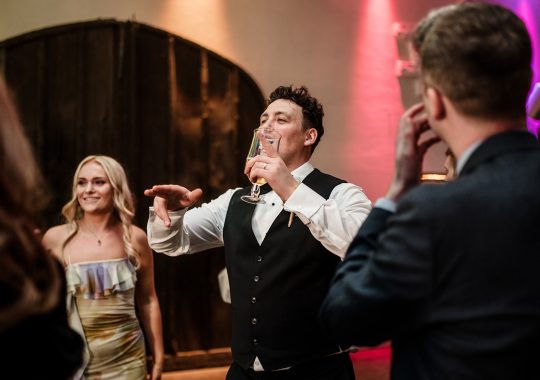 • “Bride and groom standing hand in hand outside Runa Farm’s rustic stone barn – a perfect Durham wedding venue.” • “Candid wedding moment at Runa Farm – newlyweds laughing together under twinkling lights.” • “Elegant boho wedding dress at Runa Farm – bride posing against the venue’s countryside backdrop.” • “Runa Farm wedding setup – long wooden tables, rustic décor, and soft candlelight for a romantic reception.” • “Sunset wedding portraits at Runa Farm – golden hour glow over the rolling Durham countryside.” • “Stylish groom at Runa Farm – a modern take on rustic wedding fashion.” • “The moment they said ‘I do’ – bride and groom exchanging vows in Runa Farm’s barn ceremony space.” • “Runa Farm wedding celebrations – guests raising a toast in a beautifully styled barn reception.” • “Newlyweds sharing their first dance at Runa Farm – a magical moment under fairy lights.” • “Fun wedding party portraits at Runa Farm – bridesmaids and groomsmen celebrating in the countryside.” • “Beautiful wedding bouquet at Runa Farm – dried florals, soft pastels, and rustic charm.” • “Relaxed wedding morning at Runa Farm – bride enjoying a quiet moment before the ceremony.” • “Outdoor wedding drinks reception at Runa Farm – couples and guests enjoying the sunshine and countryside views.” • “Romantic countryside wedding at Runa Farm – couple walking through lush fields at sunset.” • “Runa Farm wedding cake – elegant design with dried flowers and a rustic-luxe finish.” • “Bridal party getting ready at Runa Farm – laughter, champagne, and the perfect pre-wedding moments.” • “Emotional groom watching his bride walk down the aisle at Runa Farm’s intimate barn setting.” • “Boho-inspired wedding styling at Runa Farm – warm tones, pampas grass, and rustic wooden details.” • “Confetti moment at Runa Farm – bride and groom celebrating with family and friends in a joyful shower of petals.” • “Romantic wedding reception at Runa Farm – candlelit tables, rustic beams, and a warm, cozy atmosphere.” • “Bride and groom sharing a private moment outside Runa Farm’s stunning stone architecture.” • “Wedding guests enjoying a relaxed al fresco drinks reception at Runa Farm’s outdoor courtyard.” • “Rustic barn wedding inspiration at Runa Farm – dreamy styling with fairy lights and natural textures.” • “Newlyweds embracing outside Runa Farm’s picturesque countryside backdrop – the perfect Durham wedding setting.” • “Groom waiting at the altar at Runa Farm – the perfect rustic wedding venue for an intimate ceremony.” • “Bridal portraits at Runa Farm – timeless elegance meets countryside charm.” • “Golden hour wedding photography at Runa Farm – romantic sunset portraits of the newlyweds.” • “Sparkler exit at Runa Farm – magical wedding send-off under a starry North East sky.” • “Bride and groom sharing a relaxed moment by Runa Farm’s rustic wooden gates.” • “Romantic first look at Runa Farm – groom’s emotional reaction to seeing his bride.” • “Natural wedding photography at Runa Farm – capturing authentic moments of love and joy.” • “Bridal details at Runa Farm – lace wedding gown, delicate florals, and rustic-chic styling.” • “Outdoor wedding portraits at Runa Farm – capturing the couple in a breathtaking countryside setting.” • “Guests celebrating at Runa Farm wedding reception – joyful candid moments on the dance floor.” • “Modern rustic wedding décor at Runa Farm – beautifully styled tables with earthy tones and fresh flowers.” • “Newlyweds enjoying a quiet moment at Runa Farm’s scenic outdoor spaces.” • “Groom buttoning up his suit before the ceremony at Runa Farm – stylish and relaxed wedding morning.” • “Wedding party group shots at Runa Farm – fun, natural, and full of personality.” • “Intimate wedding dinner setup at Runa Farm – romantic lighting and beautifully arranged tables.”