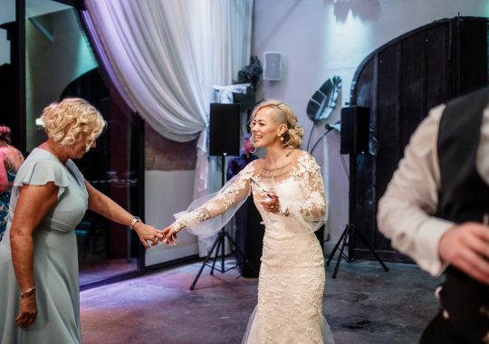 • “Bride and groom standing hand in hand outside Runa Farm’s rustic stone barn – a perfect Durham wedding venue.” • “Candid wedding moment at Runa Farm – newlyweds laughing together under twinkling lights.” • “Elegant boho wedding dress at Runa Farm – bride posing against the venue’s countryside backdrop.” • “Runa Farm wedding setup – long wooden tables, rustic décor, and soft candlelight for a romantic reception.” • “Sunset wedding portraits at Runa Farm – golden hour glow over the rolling Durham countryside.” • “Stylish groom at Runa Farm – a modern take on rustic wedding fashion.” • “The moment they said ‘I do’ – bride and groom exchanging vows in Runa Farm’s barn ceremony space.” • “Runa Farm wedding celebrations – guests raising a toast in a beautifully styled barn reception.” • “Newlyweds sharing their first dance at Runa Farm – a magical moment under fairy lights.” • “Fun wedding party portraits at Runa Farm – bridesmaids and groomsmen celebrating in the countryside.” • “Beautiful wedding bouquet at Runa Farm – dried florals, soft pastels, and rustic charm.” • “Relaxed wedding morning at Runa Farm – bride enjoying a quiet moment before the ceremony.” • “Outdoor wedding drinks reception at Runa Farm – couples and guests enjoying the sunshine and countryside views.” • “Romantic countryside wedding at Runa Farm – couple walking through lush fields at sunset.” • “Runa Farm wedding cake – elegant design with dried flowers and a rustic-luxe finish.” • “Bridal party getting ready at Runa Farm – laughter, champagne, and the perfect pre-wedding moments.” • “Emotional groom watching his bride walk down the aisle at Runa Farm’s intimate barn setting.” • “Boho-inspired wedding styling at Runa Farm – warm tones, pampas grass, and rustic wooden details.” • “Confetti moment at Runa Farm – bride and groom celebrating with family and friends in a joyful shower of petals.” • “Romantic wedding reception at Runa Farm – candlelit tables, rustic beams, and a warm, cozy atmosphere.” • “Bride and groom sharing a private moment outside Runa Farm’s stunning stone architecture.” • “Wedding guests enjoying a relaxed al fresco drinks reception at Runa Farm’s outdoor courtyard.” • “Rustic barn wedding inspiration at Runa Farm – dreamy styling with fairy lights and natural textures.” • “Newlyweds embracing outside Runa Farm’s picturesque countryside backdrop – the perfect Durham wedding setting.” • “Groom waiting at the altar at Runa Farm – the perfect rustic wedding venue for an intimate ceremony.” • “Bridal portraits at Runa Farm – timeless elegance meets countryside charm.” • “Golden hour wedding photography at Runa Farm – romantic sunset portraits of the newlyweds.” • “Sparkler exit at Runa Farm – magical wedding send-off under a starry North East sky.” • “Bride and groom sharing a relaxed moment by Runa Farm’s rustic wooden gates.” • “Romantic first look at Runa Farm – groom’s emotional reaction to seeing his bride.” • “Natural wedding photography at Runa Farm – capturing authentic moments of love and joy.” • “Bridal details at Runa Farm – lace wedding gown, delicate florals, and rustic-chic styling.” • “Outdoor wedding portraits at Runa Farm – capturing the couple in a breathtaking countryside setting.” • “Guests celebrating at Runa Farm wedding reception – joyful candid moments on the dance floor.” • “Modern rustic wedding décor at Runa Farm – beautifully styled tables with earthy tones and fresh flowers.” • “Newlyweds enjoying a quiet moment at Runa Farm’s scenic outdoor spaces.” • “Groom buttoning up his suit before the ceremony at Runa Farm – stylish and relaxed wedding morning.” • “Wedding party group shots at Runa Farm – fun, natural, and full of personality.” • “Intimate wedding dinner setup at Runa Farm – romantic lighting and beautifully arranged tables.”