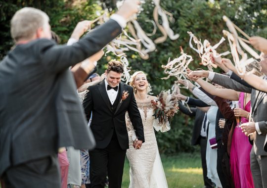 • “Dreamy wedding at Runa Farm, County Durham – rustic charm with a modern boho twist.” • “Bride and groom share a kiss outside Runa Farm’s iconic stone barn – the perfect North East wedding venue.” • “Golden hour wedding photos at Runa Farm – stunning countryside views and soft evening light.” • “Runa Farm wedding ceremony – beautifully lit rustic barn with floral arch and wooden beams.” • “Candid wedding photography at Runa Farm – newlyweds laughing during their reception.” • “Bride walking down the aisle at Runa Farm’s stunning barn venue – a perfect Durham wedding location.” • “Romantic outdoor wedding portraits at Runa Farm – lush countryside setting in County Durham.” • “Runa Farm wedding reception setup – rustic wooden tables, twinkling lights, and elegant floral centerpieces.” • “Newlyweds dancing under fairy lights at Runa Farm’s stunning barn reception space.” • “Groom waiting at the altar inside Runa Farm’s rustic barn – an intimate and stylish wedding venue.” • “Sunset wedding photography at Runa Farm, Durham – countryside charm and natural beauty.” • “Elegant boho bride at Runa Farm – modern wedding dress with a rustic backdrop.” • “Bridal party celebrating outside Runa Farm’s stone barn – relaxed wedding vibes in County Durham.” • “Candlelit wedding reception at Runa Farm – romantic and rustic North East wedding setting.” • “Bride and groom strolling through the scenic grounds of Runa Farm, Durham – perfect for countryside weddings.” • “First dance magic at Runa Farm – newlyweds twirling under twinkling lights in the barn.” • “Runa Farm wedding details – stunning dried flower arrangements and rustic décor inspiration.” • “Confetti moment at Runa Farm – newlyweds celebrating with friends and family in a beautiful countryside setting.” • “Gorgeous wedding breakfast setup at Runa Farm – boho-inspired tablescape with warm rustic charm.” • “Bride and groom embracing outside Runa Farm’s historic stone walls – a picture-perfect Durham wedding venue.”