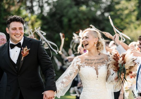 • “Dreamy wedding at Runa Farm, County Durham – rustic charm with a modern boho twist.” • “Bride and groom share a kiss outside Runa Farm’s iconic stone barn – the perfect North East wedding venue.” • “Golden hour wedding photos at Runa Farm – stunning countryside views and soft evening light.” • “Runa Farm wedding ceremony – beautifully lit rustic barn with floral arch and wooden beams.” • “Candid wedding photography at Runa Farm – newlyweds laughing during their reception.” • “Bride walking down the aisle at Runa Farm’s stunning barn venue – a perfect Durham wedding location.” • “Romantic outdoor wedding portraits at Runa Farm – lush countryside setting in County Durham.” • “Runa Farm wedding reception setup – rustic wooden tables, twinkling lights, and elegant floral centerpieces.” • “Newlyweds dancing under fairy lights at Runa Farm’s stunning barn reception space.” • “Groom waiting at the altar inside Runa Farm’s rustic barn – an intimate and stylish wedding venue.” • “Sunset wedding photography at Runa Farm, Durham – countryside charm and natural beauty.” • “Elegant boho bride at Runa Farm – modern wedding dress with a rustic backdrop.” • “Bridal party celebrating outside Runa Farm’s stone barn – relaxed wedding vibes in County Durham.” • “Candlelit wedding reception at Runa Farm – romantic and rustic North East wedding setting.” • “Bride and groom strolling through the scenic grounds of Runa Farm, Durham – perfect for countryside weddings.” • “First dance magic at Runa Farm – newlyweds twirling under twinkling lights in the barn.” • “Runa Farm wedding details – stunning dried flower arrangements and rustic décor inspiration.” • “Confetti moment at Runa Farm – newlyweds celebrating with friends and family in a beautiful countryside setting.” • “Gorgeous wedding breakfast setup at Runa Farm – boho-inspired tablescape with warm rustic charm.” • “Bride and groom embracing outside Runa Farm’s historic stone walls – a picture-perfect Durham wedding venue.”
