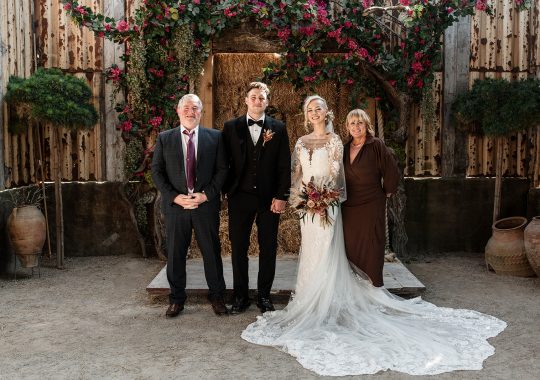 • “Romantic barn wedding at Runa Farm, County Durham – fairy lights, rustic beams, and a cozy atmosphere.” • “Bride and groom share a just-married kiss in front of Runa Farm’s stunning stone barn.” • “Runa Farm wedding photography – dreamy countryside setting with golden hour light.” • “Stylish boho wedding at Runa Farm – pampas grass, dried florals, and rustic charm.” • “Bride walking through Runa Farm’s gorgeous courtyard – perfect for a relaxed North East wedding.” • “Emotional wedding vows inside Runa Farm’s rustic-chic barn ceremony space.” • “Newlyweds celebrating outside Runa Farm’s historic stone walls – perfect for a Durham countryside wedding.” • “First dance under twinkling lights at Runa Farm – a magical wedding reception moment.” • “Sunset couple portraits at Runa Farm, Durham – capturing the romance of a countryside wedding.” • “Groom getting ready at Runa Farm – stylish and rustic pre-wedding moments.” • “Bridesmaids cheering as the bride arrives at Runa Farm – a fun wedding morning moment.” • “Rustic wedding décor at Runa Farm – elegant tablescape with candles, dried flowers, and wooden details.” • “Outdoor wedding drinks reception at Runa Farm – newlyweds mingling with guests in the sunshine.” • “Confetti shower moment at Runa Farm – the perfect candid wedding photo in County Durham.” • “Bridal entrance at Runa Farm’s rustic barn ceremony space – a stunning moment captured.” • “Fun and relaxed wedding reception at Runa Farm – guests dancing the night away under fairy lights.” • “Boho wedding dress inspiration at Runa Farm – bride in