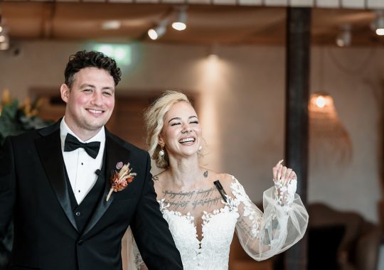 • “Romantic barn wedding at Runa Farm, County Durham – fairy lights, rustic beams, and a cozy atmosphere.” • “Bride and groom share a just-married kiss in front of Runa Farm’s stunning stone barn.” • “Runa Farm wedding photography – dreamy countryside setting with golden hour light.” • “Stylish boho wedding at Runa Farm – pampas grass, dried florals, and rustic charm.” • “Bride walking through Runa Farm’s gorgeous courtyard – perfect for a relaxed North East wedding.” • “Emotional wedding vows inside Runa Farm’s rustic-chic barn ceremony space.” • “Newlyweds celebrating outside Runa Farm’s historic stone walls – perfect for a Durham countryside wedding.” • “First dance under twinkling lights at Runa Farm – a magical wedding reception moment.” • “Sunset couple portraits at Runa Farm, Durham – capturing the romance of a countryside wedding.” • “Groom getting ready at Runa Farm – stylish and rustic pre-wedding moments.” • “Bridesmaids cheering as the bride arrives at Runa Farm – a fun wedding morning moment.” • “Rustic wedding décor at Runa Farm – elegant tablescape with candles, dried flowers, and wooden details.” • “Outdoor wedding drinks reception at Runa Farm – newlyweds mingling with guests in the sunshine.” • “Confetti shower moment at Runa Farm – the perfect candid wedding photo in County Durham.” • “Bridal entrance at Runa Farm’s rustic barn ceremony space – a stunning moment captured.” • “Fun and relaxed wedding reception at Runa Farm – guests dancing the night away under fairy lights.” • “Boho wedding dress inspiration at Runa Farm – bride in