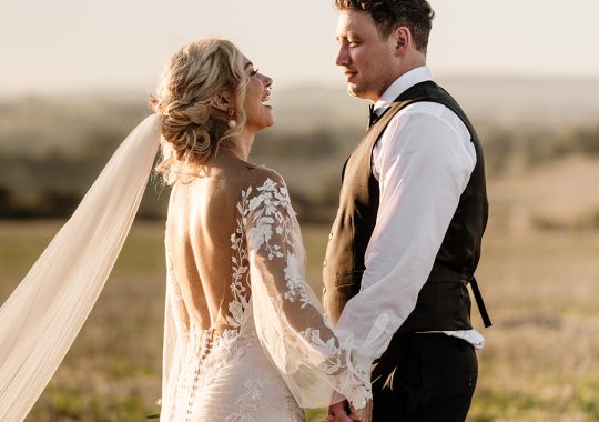 • “Bride and groom standing hand in hand outside Runa Farm’s rustic stone barn – a perfect Durham wedding venue.” • “Candid wedding moment at Runa Farm – newlyweds laughing together under twinkling lights.” • “Elegant boho wedding dress at Runa Farm – bride posing against the venue’s countryside backdrop.” • “Runa Farm wedding setup – long wooden tables, rustic décor, and soft candlelight for a romantic reception.” • “Sunset wedding portraits at Runa Farm – golden hour glow over the rolling Durham countryside.” • “Stylish groom at Runa Farm – a modern take on rustic wedding fashion.” • “The moment they said ‘I do’ – bride and groom exchanging vows in Runa Farm’s barn ceremony space.” • “Runa Farm wedding celebrations – guests raising a toast in a beautifully styled barn reception.” • “Newlyweds sharing their first dance at Runa Farm – a magical moment under fairy lights.” • “Fun wedding party portraits at Runa Farm – bridesmaids and groomsmen celebrating in the countryside.” • “Beautiful wedding bouquet at Runa Farm – dried florals, soft pastels, and rustic charm.” • “Relaxed wedding morning at Runa Farm – bride enjoying a quiet moment before the ceremony.” • “Outdoor wedding drinks reception at Runa Farm – couples and guests enjoying the sunshine and countryside views.” • “Romantic countryside wedding at Runa Farm – couple walking through lush fields at sunset.” • “Runa Farm wedding cake – elegant design with dried flowers and a rustic-luxe finish.” • “Bridal party getting ready at Runa Farm – laughter, champagne, and the perfect pre-wedding moments.” • “Emotional groom watching his bride walk down the aisle at