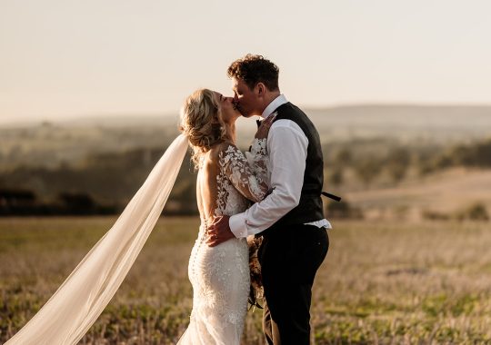 • “Bride and groom standing hand in hand outside Runa Farm’s rustic stone barn – a perfect Durham wedding venue.” • “Candid wedding moment at Runa Farm – newlyweds laughing together under twinkling lights.” • “Elegant boho wedding dress at Runa Farm – bride posing against the venue’s countryside backdrop.” • “Runa Farm wedding setup – long wooden tables, rustic décor, and soft candlelight for a romantic reception.” • “Sunset wedding portraits at Runa Farm – golden hour glow over the rolling Durham countryside.” • “Stylish groom at Runa Farm – a modern take on rustic wedding fashion.” • “The moment they said ‘I do’ – bride and groom exchanging vows in Runa Farm’s barn ceremony space.” • “Runa Farm wedding celebrations – guests raising a toast in a beautifully styled barn reception.” • “Newlyweds sharing their first dance at Runa Farm – a magical moment under fairy lights.” • “Fun wedding party portraits at Runa Farm – bridesmaids and groomsmen celebrating in the countryside.” • “Beautiful wedding bouquet at Runa Farm – dried florals, soft pastels, and rustic charm.” • “Relaxed wedding morning at Runa Farm – bride enjoying a quiet moment before the ceremony.” • “Outdoor wedding drinks reception at Runa Farm – couples and guests enjoying the sunshine and countryside views.” • “Romantic countryside wedding at Runa Farm – couple walking through lush fields at sunset.” • “Runa Farm wedding cake – elegant design with dried flowers and a rustic-luxe finish.” • “Bridal party getting ready at Runa Farm – laughter, champagne, and the perfect pre-wedding moments.” • “Emotional groom watching his bride walk down the aisle at Runa Farm’s intimate barn setting.” • “Boho-inspired wedding styling at Runa Farm – warm tones, pampas grass, and rustic wooden details.” • “Confetti moment at Runa Farm – bride and groom celebrating with family and friends in a joyful shower of petals.” • “Romantic wedding reception at Runa Farm – candlelit tables, rustic beams, and a warm, cozy atmosphere.” • “Bride and groom sharing a private moment outside Runa Farm’s stunning stone architecture.” • “Wedding guests enjoying a relaxed al fresco drinks reception at Runa Farm’s outdoor courtyard.” • “Rustic barn wedding inspiration at Runa Farm – dreamy styling with fairy lights and natural textures.” • “Newlyweds embracing outside Runa Farm’s picturesque countryside backdrop – the perfect Durham wedding setting.” • “Groom waiting at the altar at Runa Farm – the perfect rustic wedding venue for an intimate ceremony.” • “Bridal portraits at Runa Farm – timeless elegance meets countryside charm.” • “Golden hour wedding photography at Runa Farm – romantic sunset portraits of the newlyweds.” • “Sparkler exit at Runa Farm – magical wedding send-off under a starry North East sky.” • “Bride and groom sharing a relaxed moment by Runa Farm’s rustic wooden gates.” • “Romantic first look at Runa Farm – groom’s emotional reaction to seeing his bride.” • “Natural wedding photography at Runa Farm – capturing authentic moments of love and joy.” • “Bridal details at Runa Farm – lace wedding gown, delicate florals, and rustic-chic styling.” • “Outdoor wedding portraits at Runa Farm – capturing the couple in a breathtaking countryside setting.” • “Guests celebrating at Runa Farm wedding reception – joyful candid moments on the dance floor.” • “Modern rustic wedding décor at Runa Farm – beautifully styled tables with earthy tones and fresh flowers.” • “Newlyweds enjoying a quiet moment at Runa Farm’s scenic outdoor spaces.” • “Groom buttoning up his suit before the ceremony at Runa Farm – stylish and relaxed wedding morning.” • “Wedding party group shots at Runa Farm – fun, natural, and full of personality.” • “Intimate wedding dinner setup at Runa Farm – romantic lighting and beautifully arranged tables.”