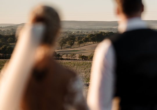 • “Bride and groom standing hand in hand outside Runa Farm’s rustic stone barn – a perfect Durham wedding venue.” • “Candid wedding moment at Runa Farm – newlyweds laughing together under twinkling lights.” • “Elegant boho wedding dress at Runa Farm – bride posing against the venue’s countryside backdrop.” • “Runa Farm wedding setup – long wooden tables, rustic décor, and soft candlelight for a romantic reception.” • “Sunset wedding portraits at Runa Farm – golden hour glow over the rolling Durham countryside.” • “Stylish groom at Runa Farm – a modern take on rustic wedding fashion.” • “The moment they said ‘I do’ – bride and groom exchanging vows in Runa Farm’s barn ceremony space.” • “Runa Farm wedding celebrations – guests raising a toast in a beautifully styled barn reception.” • “Newlyweds sharing their first dance at Runa Farm – a magical moment under fairy lights.” • “Fun wedding party portraits at Runa Farm – bridesmaids and groomsmen celebrating in the countryside.” • “Beautiful wedding bouquet at Runa Farm – dried florals, soft pastels, and rustic charm.” • “Relaxed wedding morning at Runa Farm – bride enjoying a quiet moment before the ceremony.” • “Outdoor wedding drinks reception at Runa Farm – couples and guests enjoying the sunshine and countryside views.” • “Romantic countryside wedding at Runa Farm – couple walking through lush fields at sunset.” • “Runa Farm wedding cake – elegant design with dried flowers and a rustic-luxe finish.” • “Bridal party getting ready at Runa Farm – laughter, champagne, and the perfect pre-wedding moments.” • “Emotional groom watching his bride walk down the aisle at Runa Farm’s intimate barn setting.” • “Boho-inspired wedding styling at Runa Farm – warm tones, pampas grass, and rustic wooden details.” • “Confetti moment at Runa Farm – bride and groom celebrating with family and friends in a joyful shower of petals.” • “Romantic wedding reception at Runa Farm – candlelit tables, rustic beams, and a warm, cozy atmosphere.” • “Bride and groom sharing a private moment outside Runa Farm’s stunning stone architecture.” • “Wedding guests enjoying a relaxed al fresco drinks reception at Runa Farm’s outdoor courtyard.” • “Rustic barn wedding inspiration at Runa Farm – dreamy styling with fairy lights and natural textures.” • “Newlyweds embracing outside Runa Farm’s picturesque countryside backdrop – the perfect Durham wedding setting.” • “Groom waiting at the altar at Runa Farm – the perfect rustic wedding venue for an intimate ceremony.” • “Bridal portraits at Runa Farm – timeless elegance meets countryside charm.” • “Golden hour wedding photography at Runa Farm – romantic sunset portraits of the newlyweds.” • “Sparkler exit at Runa Farm – magical wedding send-off under a starry North East sky.” • “Bride and groom sharing a relaxed moment by Runa Farm’s rustic wooden gates.” • “Romantic first look at Runa Farm – groom’s emotional reaction to seeing his bride.” • “Natural wedding photography at Runa Farm – capturing authentic moments of love and joy.” • “Bridal details at Runa Farm – lace wedding gown, delicate florals, and rustic-chic styling.” • “Outdoor wedding portraits at Runa Farm – capturing the couple in a breathtaking countryside setting.” • “Guests celebrating at Runa Farm wedding reception – joyful candid moments on the dance floor.” • “Modern rustic wedding décor at Runa Farm – beautifully styled tables with earthy tones and fresh flowers.” • “Newlyweds enjoying a quiet moment at Runa Farm’s scenic outdoor spaces.” • “Groom buttoning up his suit before the ceremony at Runa Farm – stylish and relaxed wedding morning.” • “Wedding party group shots at Runa Farm – fun, natural, and full of personality.” • “Intimate wedding dinner setup at Runa Farm – romantic lighting and beautifully arranged tables.”