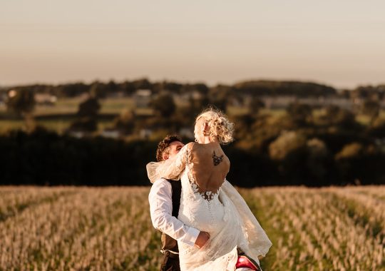 • “Bride and groom standing hand in hand outside Runa Farm’s rustic stone barn – a perfect Durham wedding venue.” • “Candid wedding moment at Runa Farm – newlyweds laughing together under twinkling lights.” • “Elegant boho wedding dress at Runa Farm – bride posing against the venue’s countryside backdrop.” • “Runa Farm wedding setup – long wooden tables, rustic décor, and soft candlelight for a romantic reception.” • “Sunset wedding portraits at Runa Farm – golden hour glow over the rolling Durham countryside.” • “Stylish groom at Runa Farm – a modern take on rustic wedding fashion.” • “The moment they said ‘I do’ – bride and groom exchanging vows in Runa Farm’s barn ceremony space.” • “Runa Farm wedding celebrations – guests raising a toast in a beautifully styled barn reception.” • “Newlyweds sharing their first dance at Runa Farm – a magical moment under fairy lights.” • “Fun wedding party portraits at Runa Farm – bridesmaids and groomsmen celebrating in the countryside.” • “Beautiful wedding bouquet at Runa Farm – dried florals, soft pastels, and rustic charm.” • “Relaxed wedding morning at Runa Farm – bride enjoying a quiet moment before the ceremony.” • “Outdoor wedding drinks reception at Runa Farm – couples and guests enjoying the sunshine and countryside views.” • “Romantic countryside wedding at Runa Farm – couple walking through lush fields at sunset.” • “Runa Farm wedding cake – elegant design with dried flowers and a rustic-luxe finish.” • “Bridal party getting ready at Runa Farm – laughter, champagne, and the perfect pre-wedding moments.” • “Emotional groom watching his bride walk down the aisle at Runa Farm’s intimate barn setting.” • “Boho-inspired wedding styling at Runa Farm – warm tones, pampas grass, and rustic wooden details.” • “Confetti moment at Runa Farm – bride and groom celebrating with family and friends in a joyful shower of petals.” • “Romantic wedding reception at Runa Farm – candlelit tables, rustic beams, and a warm, cozy atmosphere.” • “Bride and groom sharing a private moment outside Runa Farm’s stunning stone architecture.” • “Wedding guests enjoying a relaxed al fresco drinks reception at Runa Farm’s outdoor courtyard.” • “Rustic barn wedding inspiration at Runa Farm – dreamy styling with fairy lights and natural textures.” • “Newlyweds embracing outside Runa Farm’s picturesque countryside backdrop – the perfect Durham wedding setting.” • “Groom waiting at the altar at Runa Farm – the perfect rustic wedding venue for an intimate ceremony.” • “Bridal portraits at Runa Farm – timeless elegance meets countryside charm.” • “Golden hour wedding photography at Runa Farm – romantic sunset portraits of the newlyweds.” • “Sparkler exit at Runa Farm – magical wedding send-off under a starry North East sky.” • “Bride and groom sharing a relaxed moment by Runa Farm’s rustic wooden gates.” • “Romantic first look at Runa Farm – groom’s emotional reaction to seeing his bride.” • “Natural wedding photography at Runa Farm – capturing authentic moments of love and joy.” • “Bridal details at Runa Farm – lace wedding gown, delicate florals, and rustic-chic styling.” • “Outdoor wedding portraits at Runa Farm – capturing the couple in a breathtaking countryside setting.” • “Guests celebrating at Runa Farm wedding reception – joyful candid moments on the dance floor.” • “Modern rustic wedding décor at Runa Farm – beautifully styled tables with earthy tones and fresh flowers.” • “Newlyweds enjoying a quiet moment at Runa Farm’s scenic outdoor spaces.” • “Groom buttoning up his suit before the ceremony at Runa Farm – stylish and relaxed wedding morning.” • “Wedding party group shots at Runa Farm – fun, natural, and full of personality.” • “Intimate wedding dinner setup at Runa Farm – romantic lighting and beautifully arranged tables.”