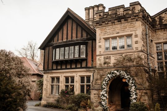 “Romantic wedding ceremony at Jesmond Dene House Hotel – elegant indoor setting with natural light and floral décor.” “Bride and groom share a kiss outside Jesmond Dene House Hotel – picturesque wedding venue in Newcastle’s countryside.” “Intimate wedding reception at Jesmond Dene House Hotel – rustic wooden tables, elegant floral arrangements, and candlelight.” “Outdoor wedding portraits at Jesmond Dene House Hotel – newlyweds surrounded by lush greenery in Jesmond Dene Park.” “Bride and groom walking hand in hand through Jesmond Dene House Hotel’s beautiful gardens – a perfect countryside wedding setting.” “Golden hour wedding photography at Jesmond Dene House Hotel – stunning sunset portraits with natural greenery.” “First dance at Jesmond Dene House Hotel – newlyweds dancing under soft lighting in a romantic and elegant setting.” “Wedding ceremony setup at Jesmond Dene House Hotel – floral arch and rustic décor for an unforgettable wedding.” “Bride and groom celebrating outside Jesmond Dene House Hotel – relaxed and joyful wedding moment in the park.” “Romantic couple portraits at Jesmond Dene House Hotel – intimate wedding photos in front of the charming country house.”