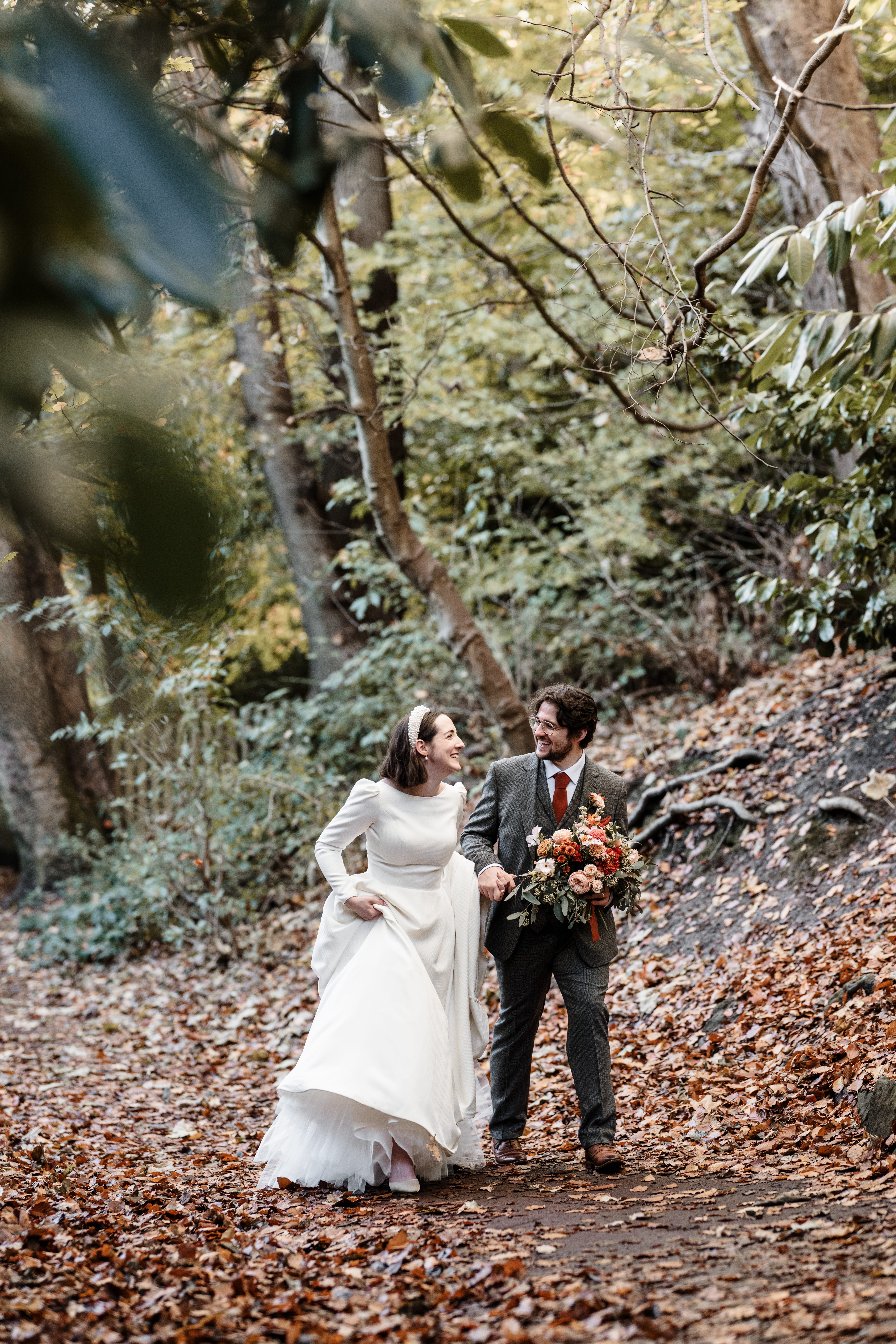 “Romantic wedding ceremony at Jesmond Dene House Hotel – elegant indoor setting with natural light and floral décor.” “Bride and groom share a kiss outside Jesmond Dene House Hotel – picturesque wedding venue in Newcastle’s countryside.” “Intimate wedding reception at Jesmond Dene House Hotel – rustic wooden tables, elegant floral arrangements, and candlelight.” “Outdoor wedding portraits at Jesmond Dene House Hotel – newlyweds surrounded by lush greenery in Jesmond Dene Park.” “Bride and groom walking hand in hand through Jesmond Dene House Hotel’s beautiful gardens – a perfect countryside wedding setting.” “Golden hour wedding photography at Jesmond Dene House Hotel – stunning sunset portraits with natural greenery.” “First dance at Jesmond Dene House Hotel – newlyweds dancing under soft lighting in a romantic and elegant setting.” “Wedding ceremony setup at Jesmond Dene House Hotel – floral arch and rustic décor for an unforgettable wedding.” “Bride and groom celebrating outside Jesmond Dene House Hotel – relaxed and joyful wedding moment in the park.” “Romantic couple portraits at Jesmond Dene House Hotel – intimate wedding photos in front of the charming country house.”