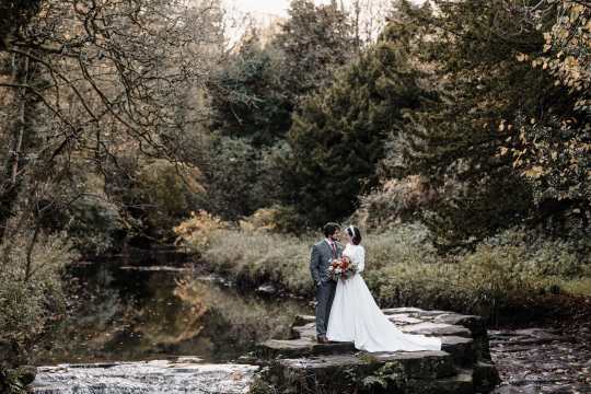 “Romantic wedding ceremony at Jesmond Dene House Hotel – elegant indoor setting with natural light and floral décor.” “Bride and groom share a kiss outside Jesmond Dene House Hotel – picturesque wedding venue in Newcastle’s countryside.” “Intimate wedding reception at Jesmond Dene House Hotel – rustic wooden tables, elegant floral arrangements, and candlelight.” “Outdoor wedding portraits at Jesmond Dene House Hotel – newlyweds surrounded by lush greenery in Jesmond Dene Park.” “Bride and groom walking hand in hand through Jesmond Dene House Hotel’s beautiful gardens – a perfect countryside wedding setting.” “Golden hour wedding photography at Jesmond Dene House Hotel – stunning sunset portraits with natural greenery.” “First dance at Jesmond Dene House Hotel – newlyweds dancing under soft lighting in a romantic and elegant setting.” “Wedding ceremony setup at Jesmond Dene House Hotel – floral arch and rustic décor for an unforgettable wedding.” “Bride and groom celebrating outside Jesmond Dene House Hotel – relaxed and joyful wedding moment in the park.” “Romantic couple portraits at Jesmond Dene House Hotel – intimate wedding photos in front of the charming country house.”