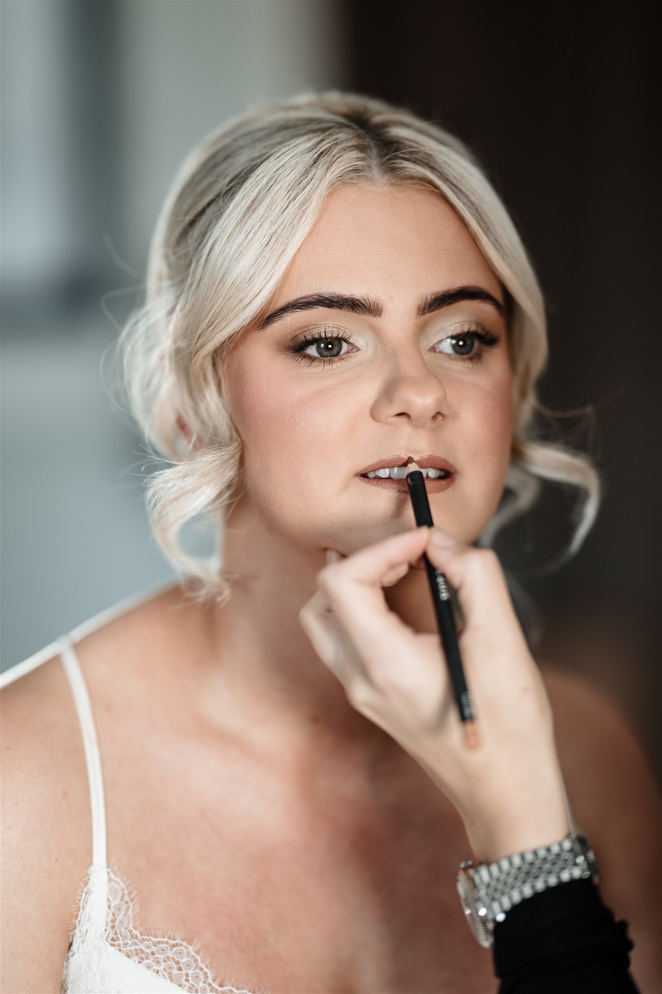 “Bride with soft, romantic curls and natural makeup, glowing in the North East of England.” “Elegant updo with delicate pearl accessories, perfect for a North East wedding.” “Bridal makeup with a flawless dewy finish, captured in Newcastle upon Tyne.” “Classic Hollywood waves and a bold red lip for a vintage-inspired North East bride.” “Boho bride with loose waves and fresh floral hair accessories in Durham.” “Sleek bridal bun with soft glam makeup, ready for a wedding in Northumberland.” “Timeless chignon and subtle smokey eye makeup, perfect for a chic North East wedding.” “Natural bridal makeup with soft pink tones, complementing an elegant wedding dress.” “Bride with a half-up, half-down hairstyle and warm, golden-toned makeup.” “Romantic bridal updo with intricate braids and delicate makeup in Teesside.” “North East bride with glowing, radiant skin and soft, neutral eye makeup.” “Loose, textured bridal waves paired wedding venue