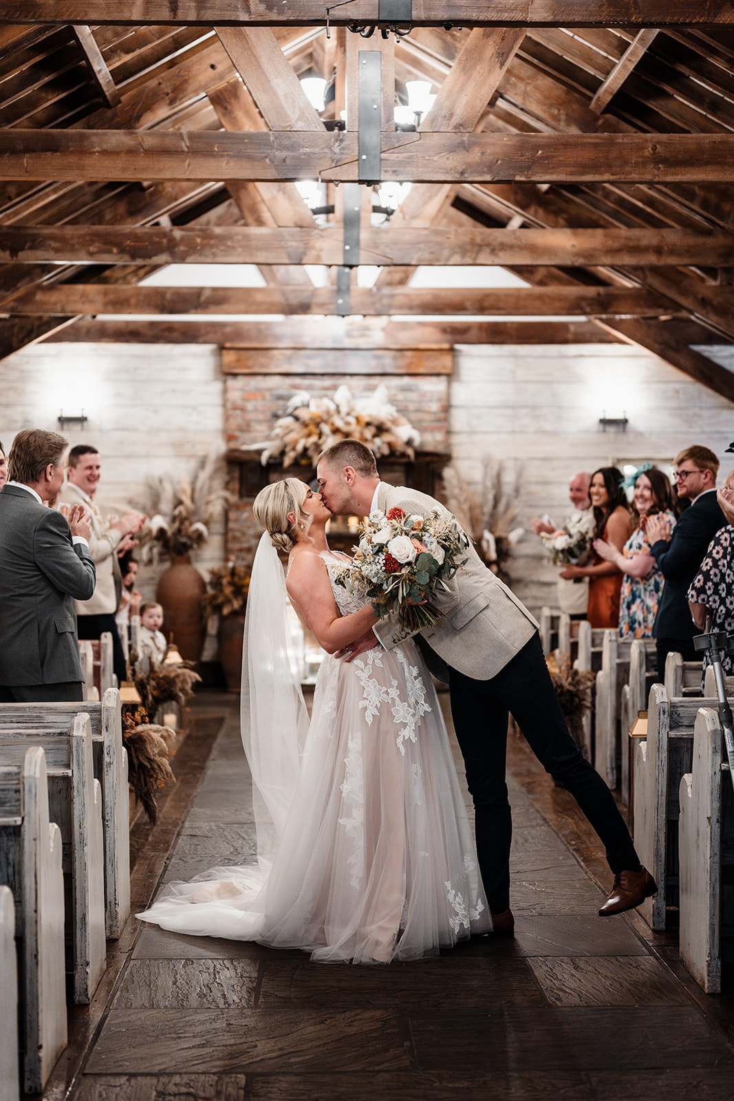 Bride and groom sharing a romantic moment at South Causey Inn wedding venue. The Old Barn at South Causey Inn beautifully decorated for a wedding ceremony. Sunset wedding portraits in the scenic countryside of South Causey Inn. Elegant wedding reception setup inside the Durham Suite at South Causey Inn. Bride getting ready in a cosy South Causey Inn bridal suite before the big day. Couple’s first dance under fairy lights in The Old Barn at South Causey Inn. Newlyweds celebrating with guests at a South Causey Inn wedding reception. Candid wedding photography capturing heartfelt moments at South Causey Inn. Luxury wedding accommodation at South Causey Inn, perfect for newlyweds. South Causey Inn wedding venue surrounded by beautiful gardens and countryside.
