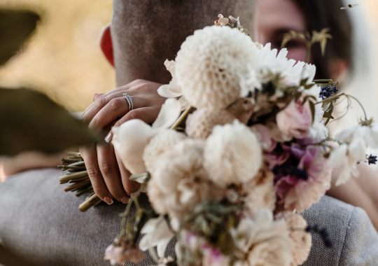 Romantic wedding at Eden Barn, Cumbria – rustic stone barn with fairy lights and countryside views. Bride and groom at Eden Barn, a charming wedding venue in Cumbria with exposed stone walls and wooden beams. Rustic wedding reception at Eden Barn – elegant tablescapes, candlelight, and floral decor in a historic barn setting. Outdoor wedding ceremony at Eden Barn, Cumbria – scenic countryside backdrop with a beautifully styled aisle. Bride and groom sharing their first dance under fairy lights in the atmospheric Eden Barn, Cumbria. Candid wedding photography at Eden Barn – newlyweds enjoying a golden hour moment in the Cumbrian countryside. Intimate wedding dinner at Eden Barn, Cumbria – rustic wooden tables, greenery, and soft lighting. Eden Barn wedding venue – a romantic, family-run barn in the heart of Cumbria’s rolling countryside. Bridal portrait at Eden Barn, Cumbria – stunning wedding dress captured in soft natural light. Groom’s first look reaction at Eden Barn – emotional moment in a rustic barn wedding setting. Evening wedding reception at Eden Barn – cozy, candlelit barn with fairy lights and dancing. Wedding cake display at Eden Barn, Cumbria – beautifully decorated rustic cake with floral accents. Bridal party celebrations at Eden Barn – bridesmaids and groomsmen enjoying the stunning countryside venue. Sunset wedding photography at Eden Barn – breathtaking golden hour shots of the newlyweds. Confetti moment at Eden Barn, Cumbria – joyful wedding guests celebrating outside the historic stone barn. Rustic wedding details at Eden Barn – boho-inspired table settings, wildflowers, and vintage decor. Emotional wedding vows at Eden Barn – heartfelt ceremony in a charming countryside barn setting. Bride and groom walking hand in hand at Eden Barn – natural and relaxed wedding photography. Live wedding band at Eden Barn – guests dancing under the twinkling fairy lights in a rustic barn venue. Luxury barn wedding at Eden Barn, Cumbria – elegant styling meets countryside charm for the perfect day.
