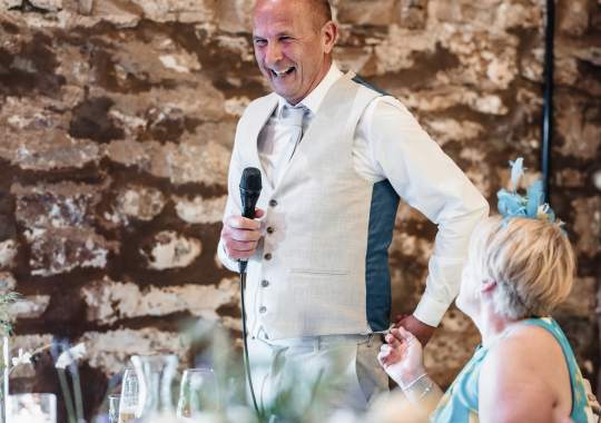 Romantic wedding at Eden Barn, Cumbria – rustic stone barn with fairy lights and countryside views. Bride and groom at Eden Barn, a charming wedding venue in Cumbria with exposed stone walls and wooden beams. Rustic wedding reception at Eden Barn – elegant tablescapes, candlelight, and floral decor in a historic barn setting. Outdoor wedding ceremony at Eden Barn, Cumbria – scenic countryside backdrop with a beautifully styled aisle. Bride and groom sharing their first dance under fairy lights in the atmospheric Eden Barn, Cumbria. Candid wedding photography at Eden Barn – newlyweds enjoying a golden hour moment in the Cumbrian countryside. Intimate wedding dinner at Eden Barn, Cumbria – rustic wooden tables, greenery, and soft lighting. Eden Barn wedding venue – a romantic, family-run barn in the heart of Cumbria’s rolling countryside. Bridal portrait at Eden Barn, Cumbria – stunning wedding dress captured in soft natural light. Groom’s first look reaction at Eden Barn – emotional moment in a rustic barn wedding setting. Evening wedding reception at Eden Barn – cozy, candlelit barn with fairy lights and dancing. Wedding cake display at Eden Barn, Cumbria – beautifully decorated rustic cake with floral accents. Bridal party celebrations at Eden Barn – bridesmaids and groomsmen enjoying the stunning countryside venue. Sunset wedding photography at Eden Barn – breathtaking golden hour shots of the newlyweds. Confetti moment at Eden Barn, Cumbria – joyful wedding guests celebrating outside the historic stone barn. Rustic wedding details at Eden Barn – boho-inspired table settings, wildflowers, and vintage decor. Emotional wedding vows at Eden Barn – heartfelt ceremony in a charming countryside barn setting. Bride and groom walking hand in hand at Eden Barn – natural and relaxed wedding photography. Live wedding band at Eden Barn – guests dancing under the twinkling fairy lights in a rustic barn venue. Luxury barn wedding at Eden Barn, Cumbria – elegant styling meets countryside charm for the perfect day.