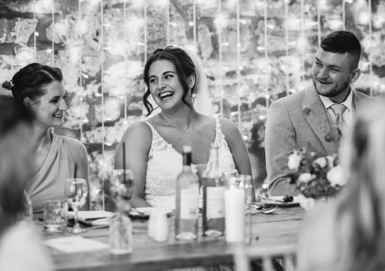 Romantic wedding at Eden Barn, Cumbria – rustic stone barn with fairy lights and countryside views. Bride and groom at Eden Barn, a charming wedding venue in Cumbria with exposed stone walls and wooden beams. Rustic wedding reception at Eden Barn – elegant tablescapes, candlelight, and floral decor in a historic barn setting. Outdoor wedding ceremony at Eden Barn, Cumbria – scenic countryside backdrop with a beautifully styled aisle. Bride and groom sharing their first dance under fairy lights in the atmospheric Eden Barn, Cumbria. Candid wedding photography at Eden Barn – newlyweds enjoying a golden hour moment in the Cumbrian countryside. Intimate wedding dinner at Eden Barn, Cumbria – rustic wooden tables, greenery, and soft lighting. Eden Barn wedding venue – a romantic, family-run barn in the heart of Cumbria’s rolling countryside. Bridal portrait at Eden Barn, Cumbria – stunning wedding dress captured in soft natural light. Groom’s first look reaction at Eden Barn – emotional moment in a rustic barn wedding setting. Evening wedding reception at Eden Barn – cozy, candlelit barn with fairy lights and dancing. Wedding cake display at Eden Barn, Cumbria – beautifully decorated rustic cake with floral accents. Bridal party celebrations at Eden Barn – bridesmaids and groomsmen enjoying the stunning countryside venue. Sunset wedding photography at Eden Barn – breathtaking golden hour shots of the newlyweds. Confetti moment at Eden Barn, Cumbria – joyful wedding guests celebrating outside the historic stone barn. Rustic wedding details at Eden Barn – boho-inspired table settings, wildflowers, and vintage decor. Emotional wedding vows at Eden Barn – heartfelt ceremony in a charming countryside barn setting. Bride and groom walking hand in hand at Eden Barn – natural and relaxed wedding photography. Live wedding band at Eden Barn – guests dancing under the twinkling fairy lights in a rustic barn venue. Luxury barn wedding at Eden Barn, Cumbria – elegant styling meets countryside charm for the perfect day.