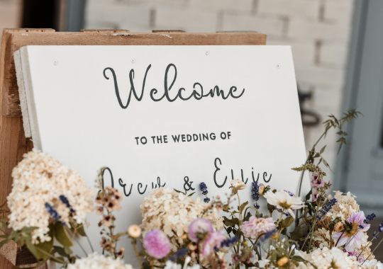 Romantic wedding at Eden Barn, Cumbria – rustic stone barn with fairy lights and countryside views. Bride and groom at Eden Barn, a charming wedding venue in Cumbria with exposed stone walls and wooden beams. Rustic wedding reception at Eden Barn – elegant tablescapes, candlelight, and floral decor in a historic barn setting. Outdoor wedding ceremony at Eden Barn, Cumbria – scenic countryside backdrop with a beautifully styled aisle. Bride and groom sharing their first dance under fairy lights in the atmospheric Eden Barn, Cumbria. Candid wedding photography at Eden Barn – newlyweds enjoying a golden hour moment in the Cumbrian countryside. Intimate wedding dinner at Eden Barn, Cumbria – rustic wooden tables, greenery, and soft lighting. Eden Barn wedding venue – a romantic, family-run barn in the heart of Cumbria’s rolling countryside. Bridal portrait at Eden Barn, Cumbria – stunning wedding dress captured in soft natural light. Groom’s first look reaction at Eden Barn – emotional moment in a rustic barn wedding setting. Evening wedding reception at Eden Barn – cozy, candlelit barn with fairy lights and dancing. Wedding cake display at Eden Barn, Cumbria – beautifully decorated rustic cake with floral accents. Bridal party celebrations at Eden Barn – bridesmaids and groomsmen enjoying the stunning countryside venue. Sunset wedding photography at Eden Barn – breathtaking golden hour shots of the newlyweds. Confetti moment at Eden Barn, Cumbria – joyful wedding guests celebrating outside the historic stone barn. Rustic wedding details at Eden Barn – boho-inspired table settings, wildflowers, and vintage decor. Emotional wedding vows at Eden Barn – heartfelt ceremony in a charming countryside barn setting. Bride and groom walking hand in hand at Eden Barn – natural and relaxed wedding photography. Live wedding band at Eden Barn – guests dancing under the twinkling fairy lights in a rustic barn venue. Luxury barn wedding at Eden Barn, Cumbria – elegant styling meets countryside charm for the perfect day.