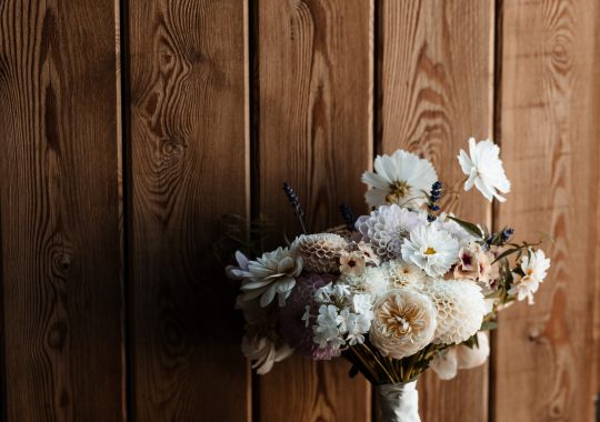 Romantic wedding at Eden Barn, Cumbria – rustic stone barn with fairy lights and countryside views. Bride and groom at Eden Barn, a charming wedding venue in Cumbria with exposed stone walls and wooden beams. Rustic wedding reception at Eden Barn – elegant tablescapes, candlelight, and floral decor in a historic barn setting. Outdoor wedding ceremony at Eden Barn, Cumbria – scenic countryside backdrop with a beautifully styled aisle. Bride and groom sharing their first dance under fairy lights in the atmospheric Eden Barn, Cumbria. Candid wedding photography at Eden Barn – newlyweds enjoying a golden hour moment in the Cumbrian countryside. Intimate wedding dinner at Eden Barn, Cumbria – rustic wooden tables, greenery, and soft lighting. Eden Barn wedding venue – a romantic, family-run barn in the heart of Cumbria’s rolling countryside. Bridal portrait at Eden Barn, Cumbria – stunning wedding dress captured in soft natural light. Groom’s first look reaction at Eden Barn – emotional moment in a rustic barn wedding setting. Evening wedding reception at Eden Barn – cozy, candlelit barn with fairy lights and dancing. Wedding cake display at Eden Barn, Cumbria – beautifully decorated rustic cake with floral accents. Bridal party celebrations at Eden Barn – bridesmaids and groomsmen enjoying the stunning countryside venue. Sunset wedding photography at Eden Barn – breathtaking golden hour shots of the newlyweds. Confetti moment at Eden Barn, Cumbria – joyful wedding guests celebrating outside the historic stone barn. Rustic wedding details at Eden Barn – boho-inspired table settings, wildflowers, and vintage decor. Emotional wedding vows at Eden Barn – heartfelt ceremony in a charming countryside barn setting. Bride and groom walking hand in hand at Eden Barn – natural and relaxed wedding photography. Live wedding band at Eden Barn – guests dancing under the twinkling fairy lights in a rustic barn venue. Luxury barn wedding at Eden Barn, Cumbria – elegant styling meets countryside charm for the perfect day.
