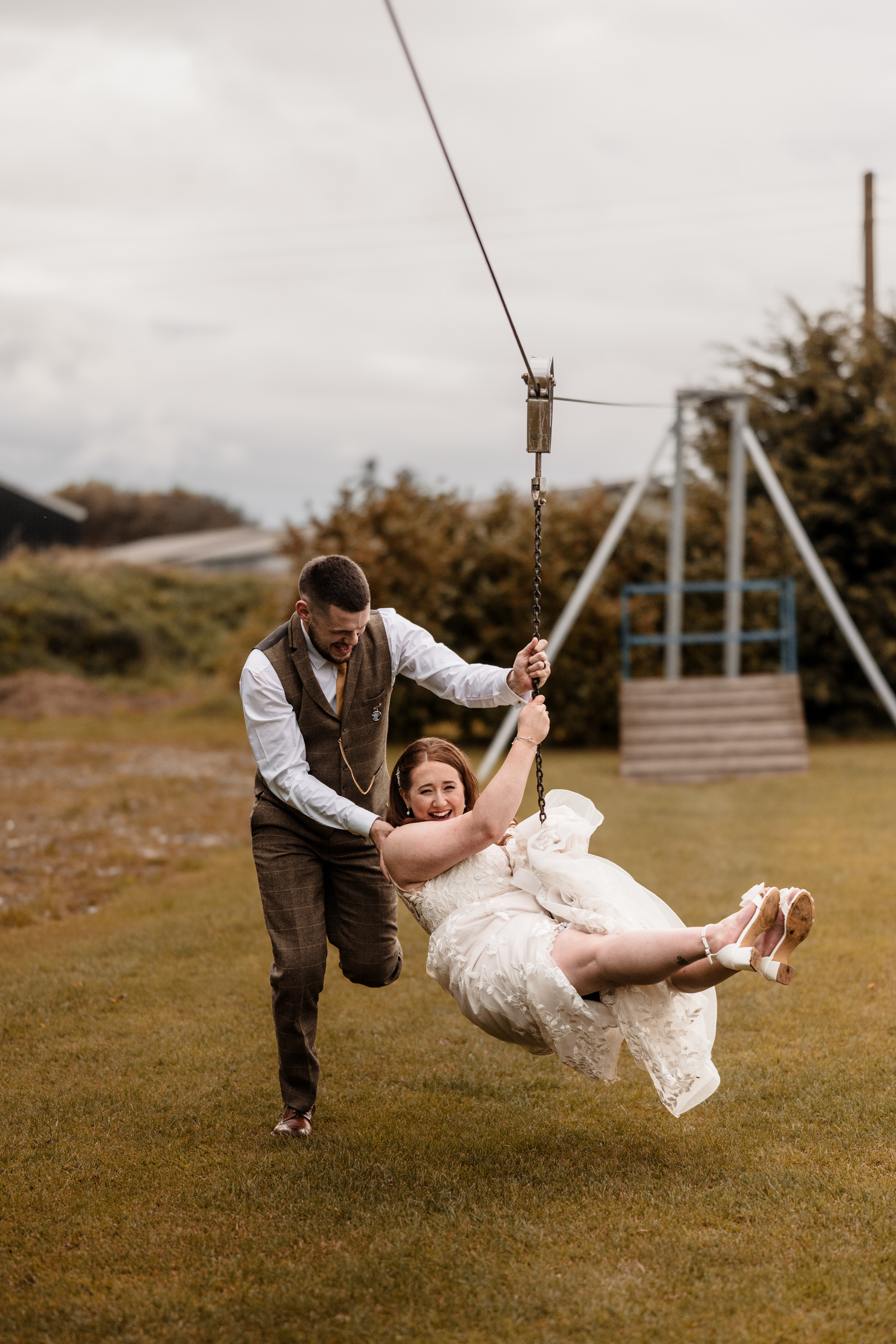 Bride and groom at Northside Farm wedding, Northumberland countryside backdrop Rustic barn wedding ceremony at Northside Farm with fairy lights and wooden beams Golden hour wedding portraits at Northside Farm, Northumberland Couple’s first dance inside Northside Farm barn, surrounded by twinkling lights Bride getting ready in Northside Farm shepherd’s hut on wedding morning Natural countryside wedding photography at Northside Farm, UK Candid wedding guest moments at Northside Farm barn reception Outdoor wedding portraits at Northside Farm with rolling hills and open fields Groom waiting at the altar inside Northside Farm’s rustic barn wedding venue Relaxed, fun wedding photography at Northside Farm in Northumberland