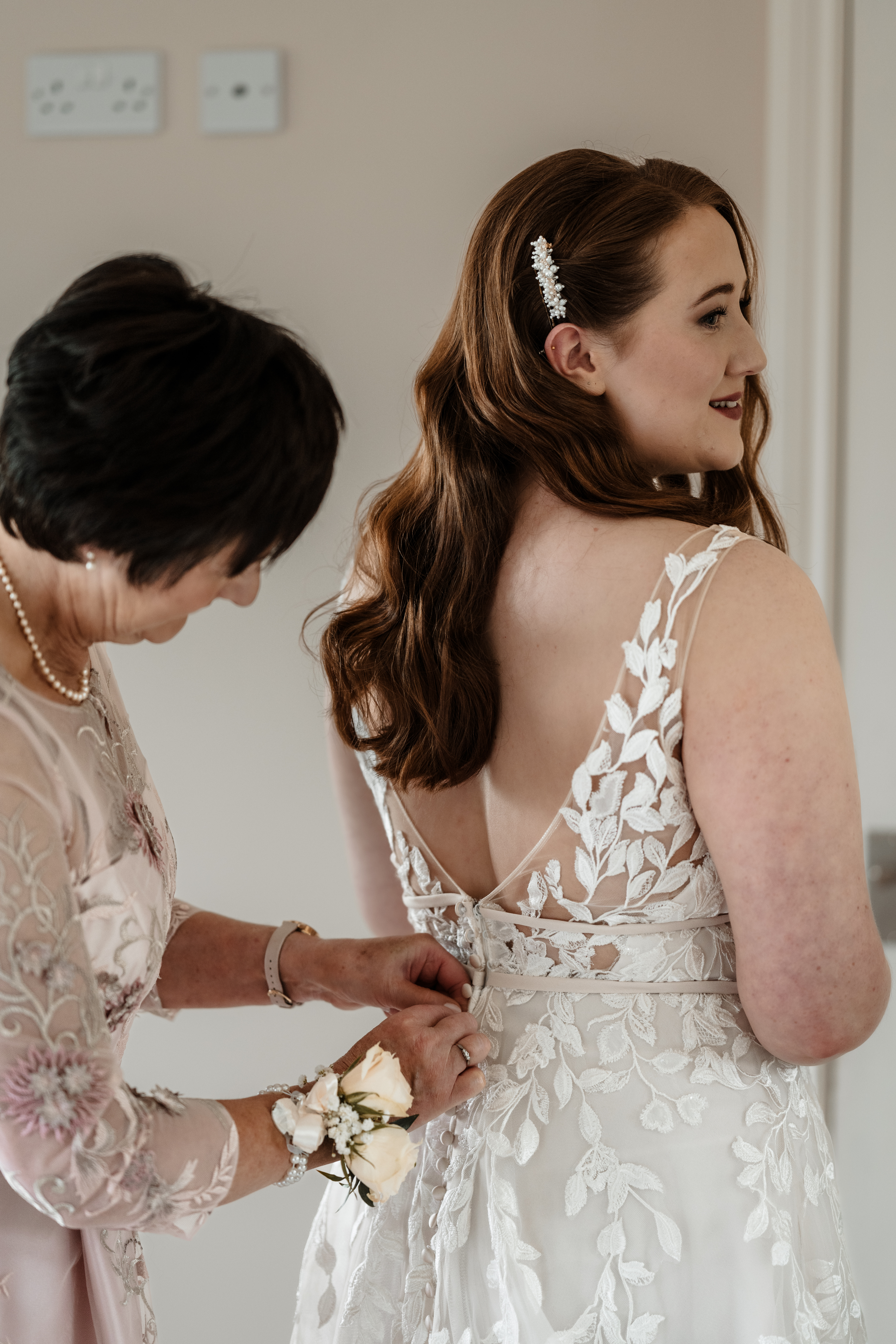 Bride and groom at Northside Farm wedding, Northumberland countryside backdrop Rustic barn wedding ceremony at Northside Farm with fairy lights and wooden beams Golden hour wedding portraits at Northside Farm, Northumberland Couple’s first dance inside Northside Farm barn, surrounded by twinkling lights Bride getting ready in Northside Farm shepherd’s hut on wedding morning Natural countryside wedding photography at Northside Farm, UK Candid wedding guest moments at Northside Farm barn reception Outdoor wedding portraits at Northside Farm with rolling hills and open fields Groom waiting at the altar inside Northside Farm’s rustic barn wedding venue Relaxed, fun wedding photography at Northside Farm in Northumberland