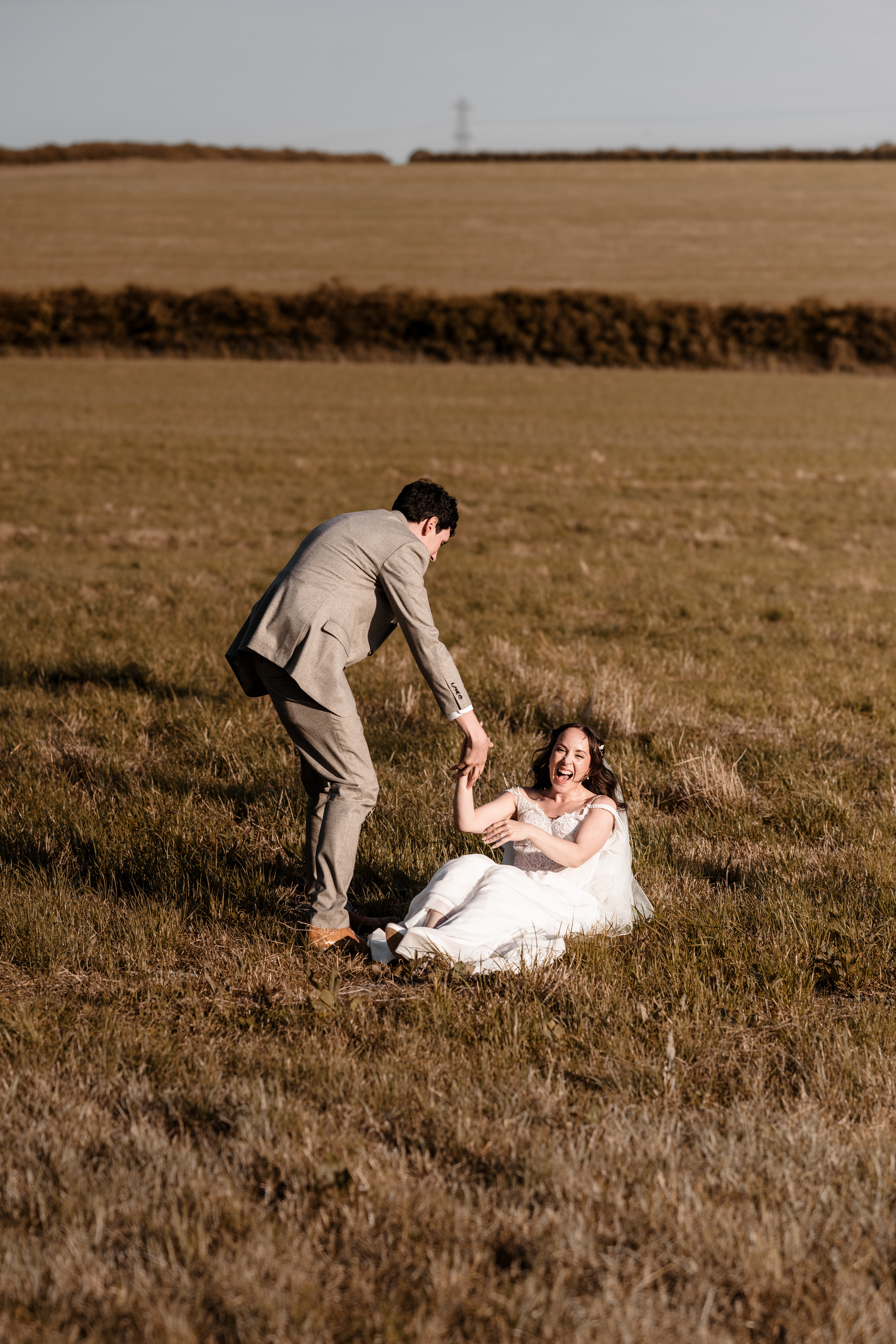 Bride and groom walking hand in hand at Northside Farm wedding venue Romantic countryside wedding photography at Northside Farm, Northumberland Rustic barn wedding reception with fairy lights and wooden beams at Northside Farm Bride and groom sharing a quiet moment outside Northside Farm’s stone barn Golden hour wedding couple portraits at Northside Farm with rolling hills in the background Natural and candid wedding photography at Northside Farm, UK Guests celebrating at a Northside Farm wedding reception inside the barn Bride getting ready inside a shepherd’s hut at Northside Farm wedding venue Couple’s first kiss as newlyweds at Northside Farm’s rustic barn ceremony Emotional first look between bride and groom at Northside Farm, Northumberland