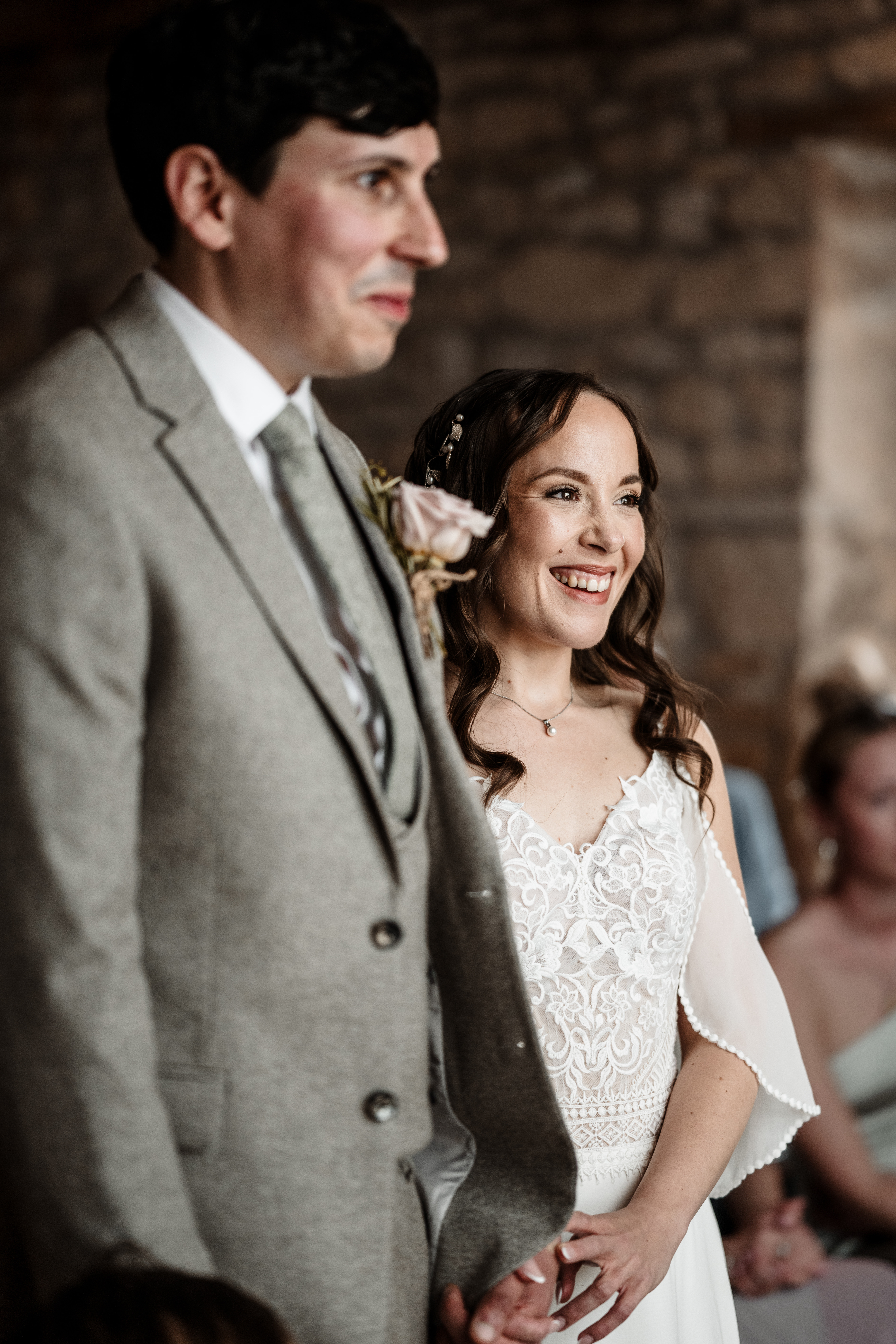 Bride and groom walking hand in hand at Northside Farm wedding venue Romantic countryside wedding photography at Northside Farm, Northumberland Rustic barn wedding reception with fairy lights and wooden beams at Northside Farm Bride and groom sharing a quiet moment outside Northside Farm’s stone barn Golden hour wedding couple portraits at Northside Farm with rolling hills in the background Natural and candid wedding photography at Northside Farm, UK Guests celebrating at a Northside Farm wedding reception inside the barn Bride getting ready inside a shepherd’s hut at Northside Farm wedding venue Couple’s first kiss as newlyweds at Northside Farm’s rustic barn ceremony Emotional first look between bride and groom at Northside Farm, Northumberland